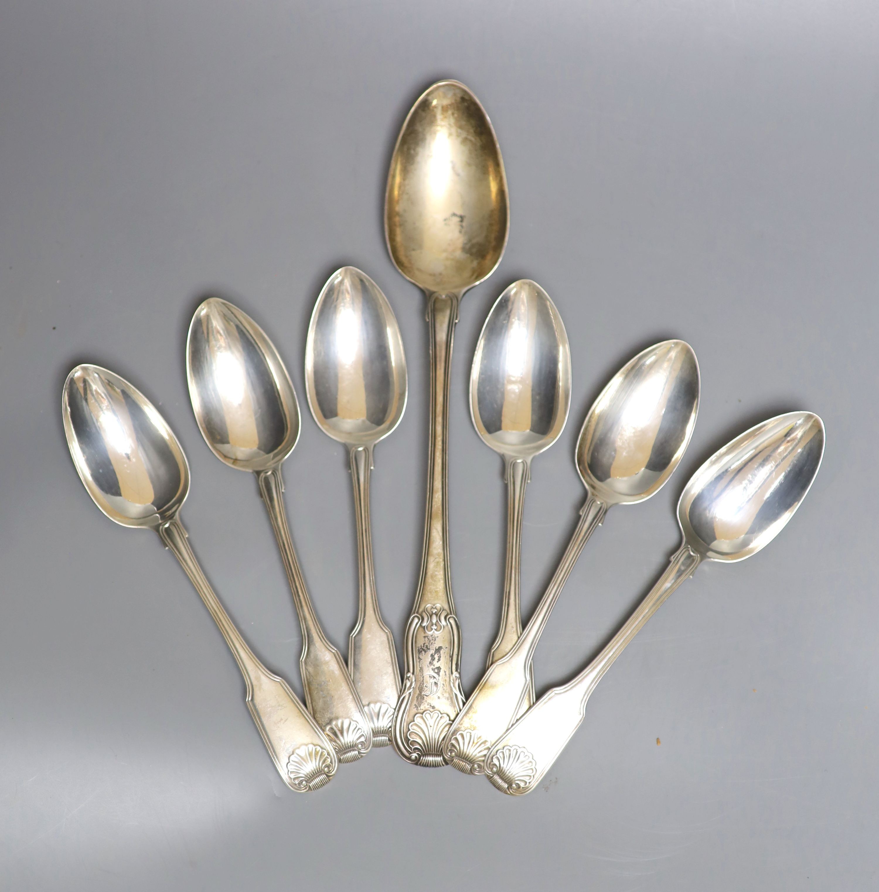 A harlequin set of six 19th century silver fiddle, thread and shell pattern tablespoons and a George III silver hourglass pattern basting spoon, by Eley & Fearn, 20oz.